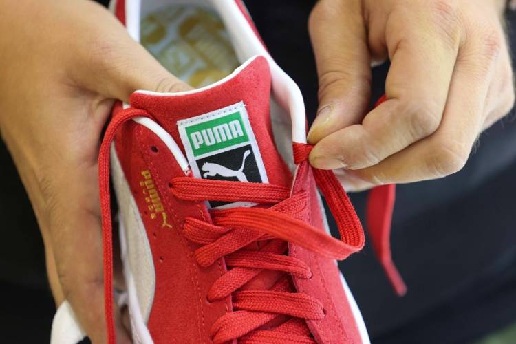 La familia Pinault evalúa una posible venta de Puma